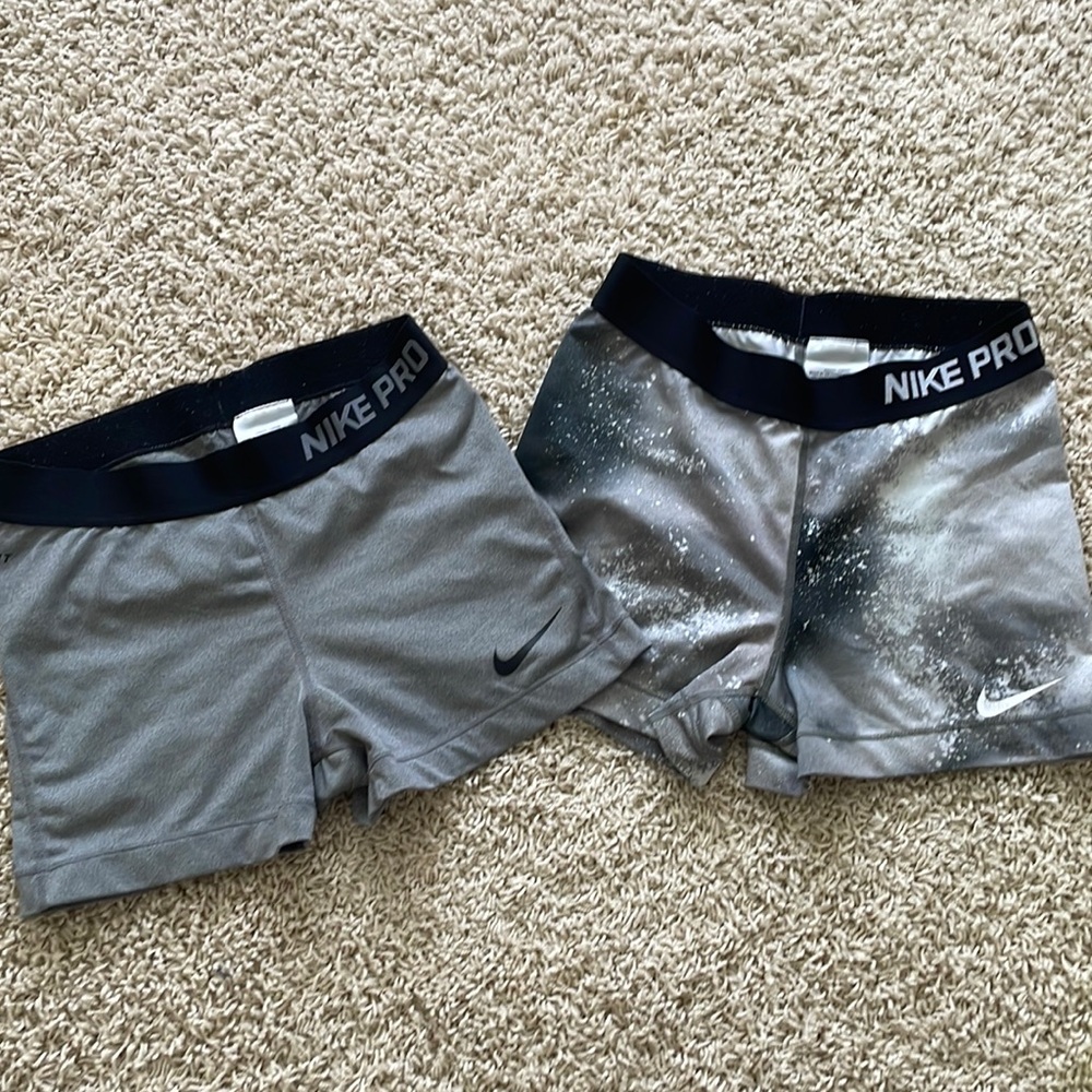 2- pairs Nike pro short both, size medium